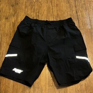 Men's Black Cycle Shorts with Reflective Stripes and padding.